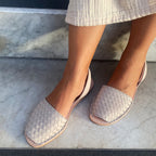 braided leather sandal in grey stone colour on marble floor